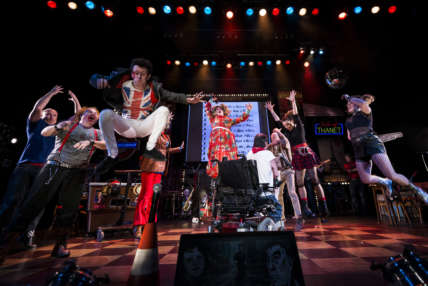 Reasons to be Cheerful cast jumps on stage