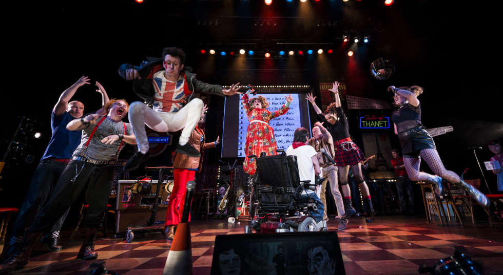 Reasons to be Cheerful cast jumps on stage