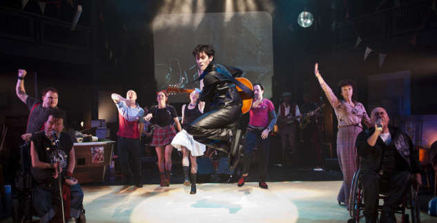 Image of man jumping in the air with serveral cast behind him on set of Reasons to be Cheerful