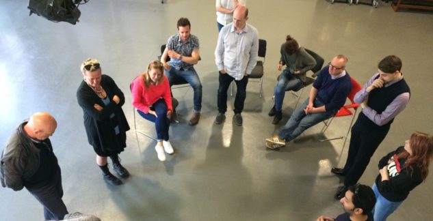 Image of Graeae team and participants in a circle talking