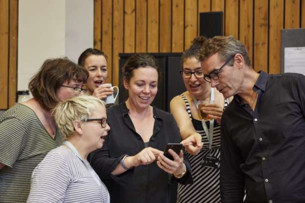 A photo of Nickie Miles-Wildin working with Rufus Norris and Olivia Colman